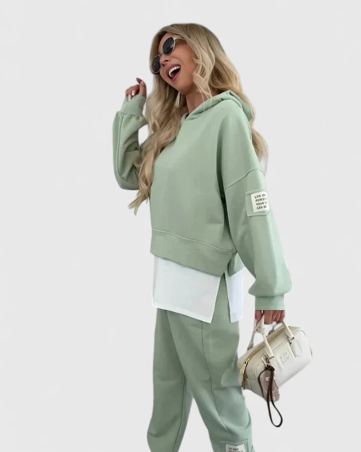 Green hooded sweatshirt and jogger set with white layered underpiece
