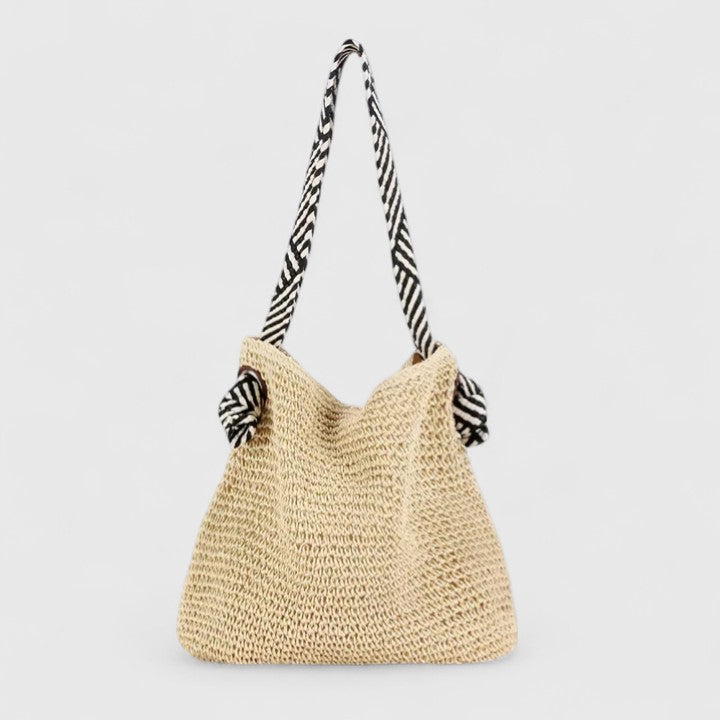 Natural beige woven boho tote bag with two black-and-white striped fabric handles