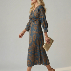 Blue wrap midi dress with long sleeves and gold leaf pattern, V-neck and waist tie