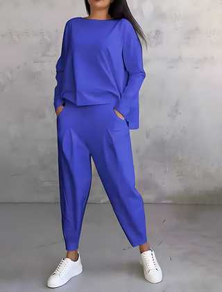 Blue two-piece lounge set with long-sleeve sweatshirt and tapered ankle jogger pants