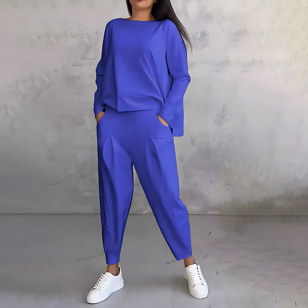 Blue two-piece lounge set with long-sleeve sweatshirt and tapered ankle jogger pants