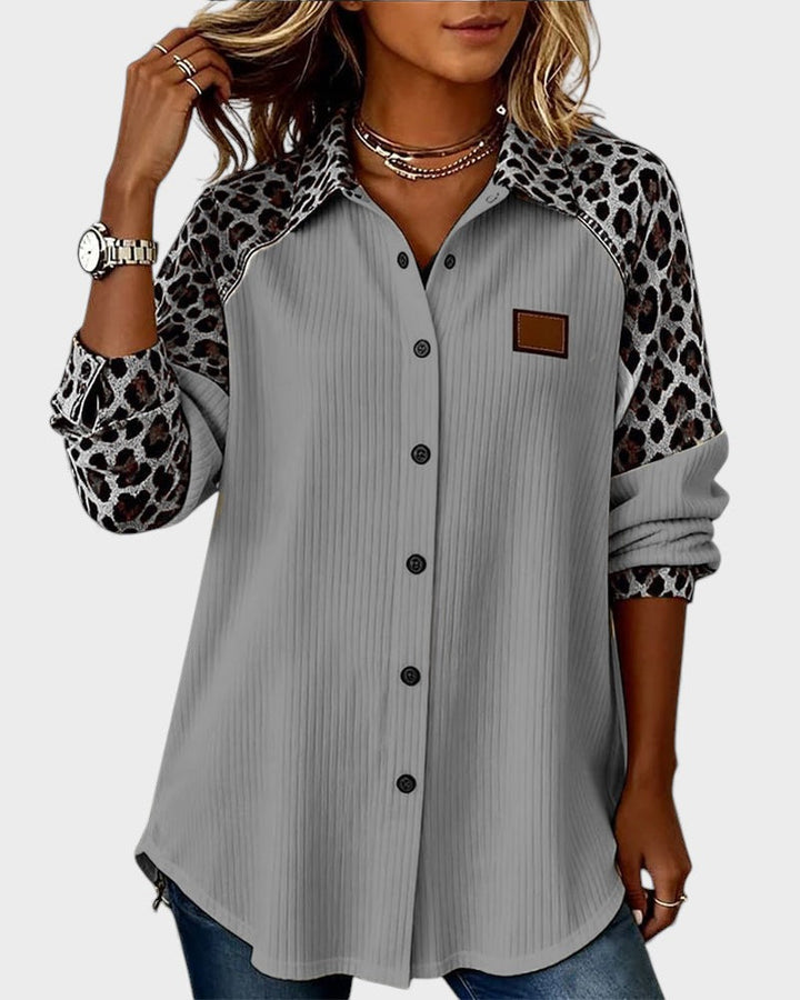 Women's button-down shirt with leopard-print contrast sleeves and light gray pinstripe front
