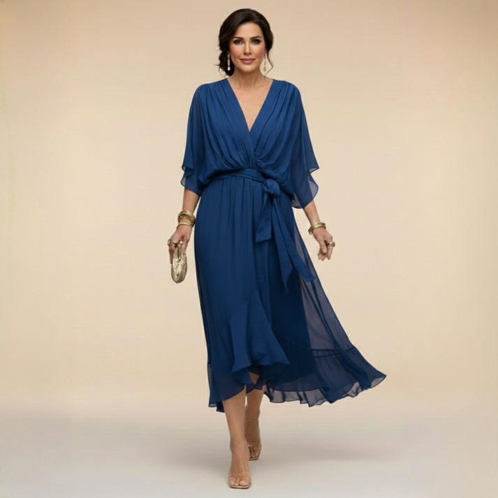 Blue V-neck wrap dress with tied waist and flutter sleeves with chiffon drape
