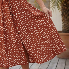 Red printed midi dress with gathered waist and button-front skirt