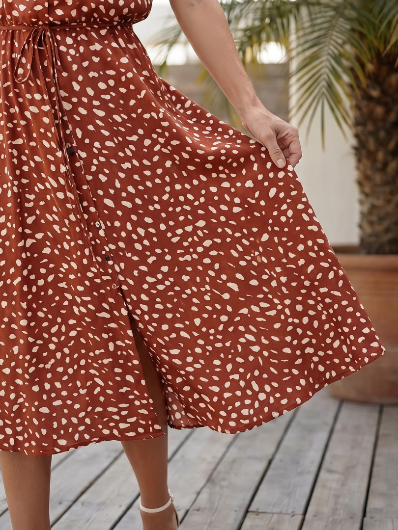 Red printed midi dress with gathered waist and button-front skirt