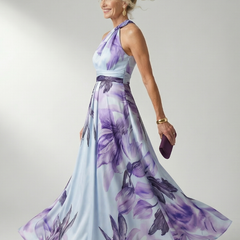 Floral halter maxi dress in pale blue with purple leaf and flower print; full skirt