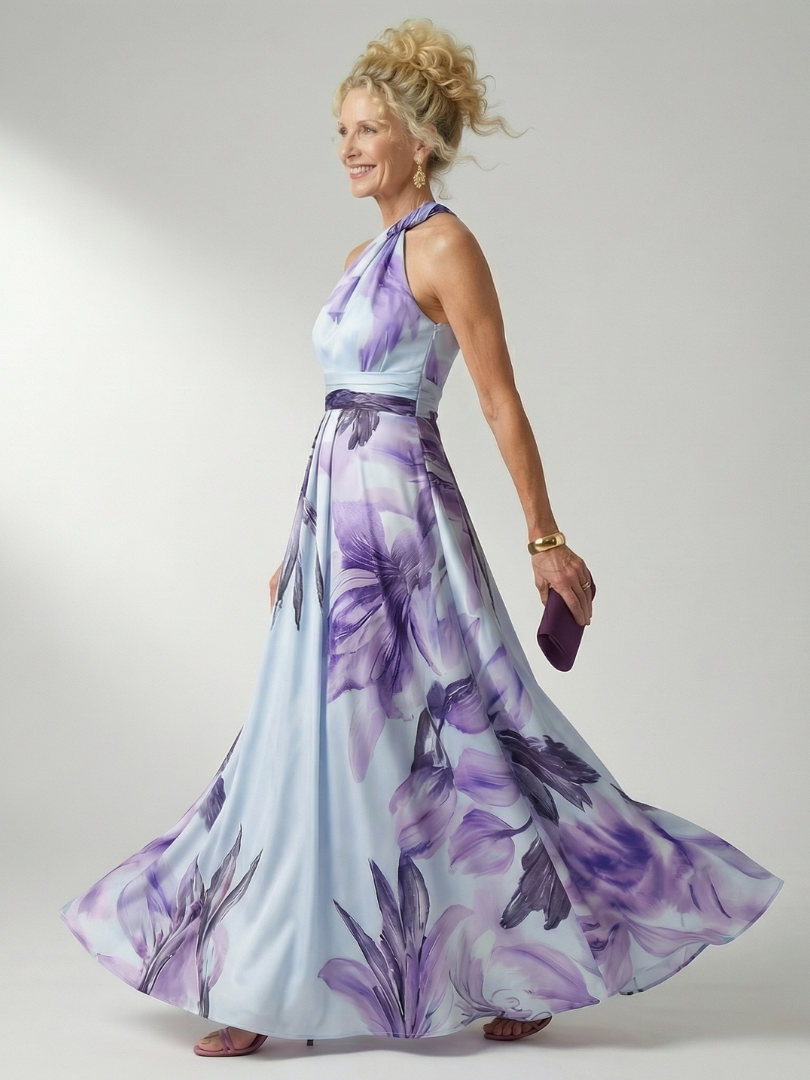 Floral halter maxi dress in pale blue with purple leaf and flower print; full skirt