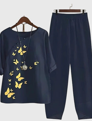 Two-piece set: navy short-sleeve top and matching pants, yellow butterfly print
