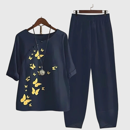 Two-piece set: navy short-sleeve top and matching pants, yellow butterfly print