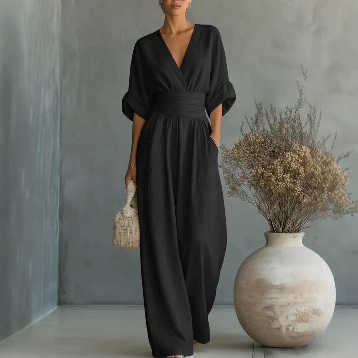 Women’s wide-leg jumpsuit in black with V-neck and elastic waist