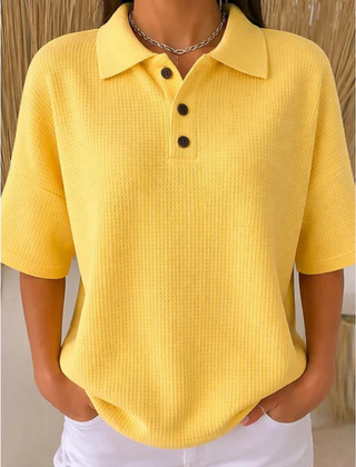 Yellow waffle knit polo blouse with short sleeves, pointed collar, three-button placket