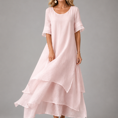 Women's pink tiered maxi dress with short sleeves and layered ruffle hem