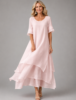 Women's pink tiered maxi dress with short sleeves and layered ruffle hem