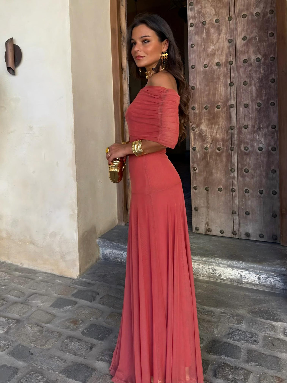 Berry red ruched sleeveless maxi dress with flowing tiered skirt, side view