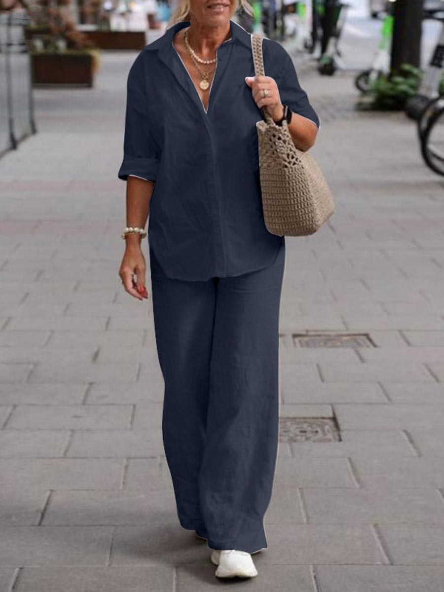 Navy two-piece set with short-sleeve button-up shirt and wide-leg pants