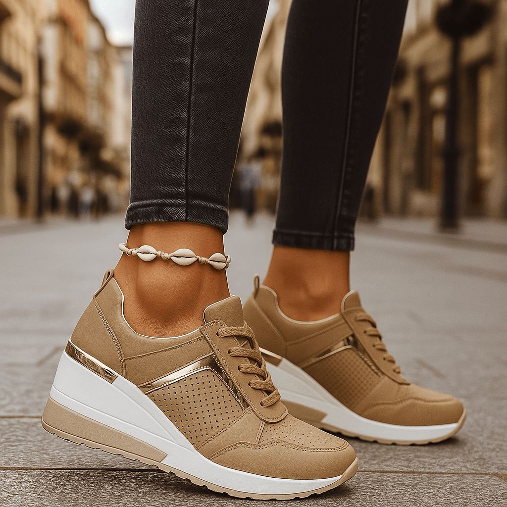 Tan lace-up sneakers with perforated toe and thick white sole.