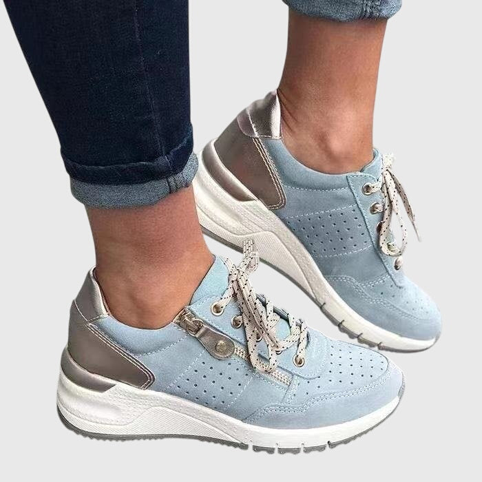 Light blue orthopedic sneakers with lace-up, perforated uppers and padded collar
