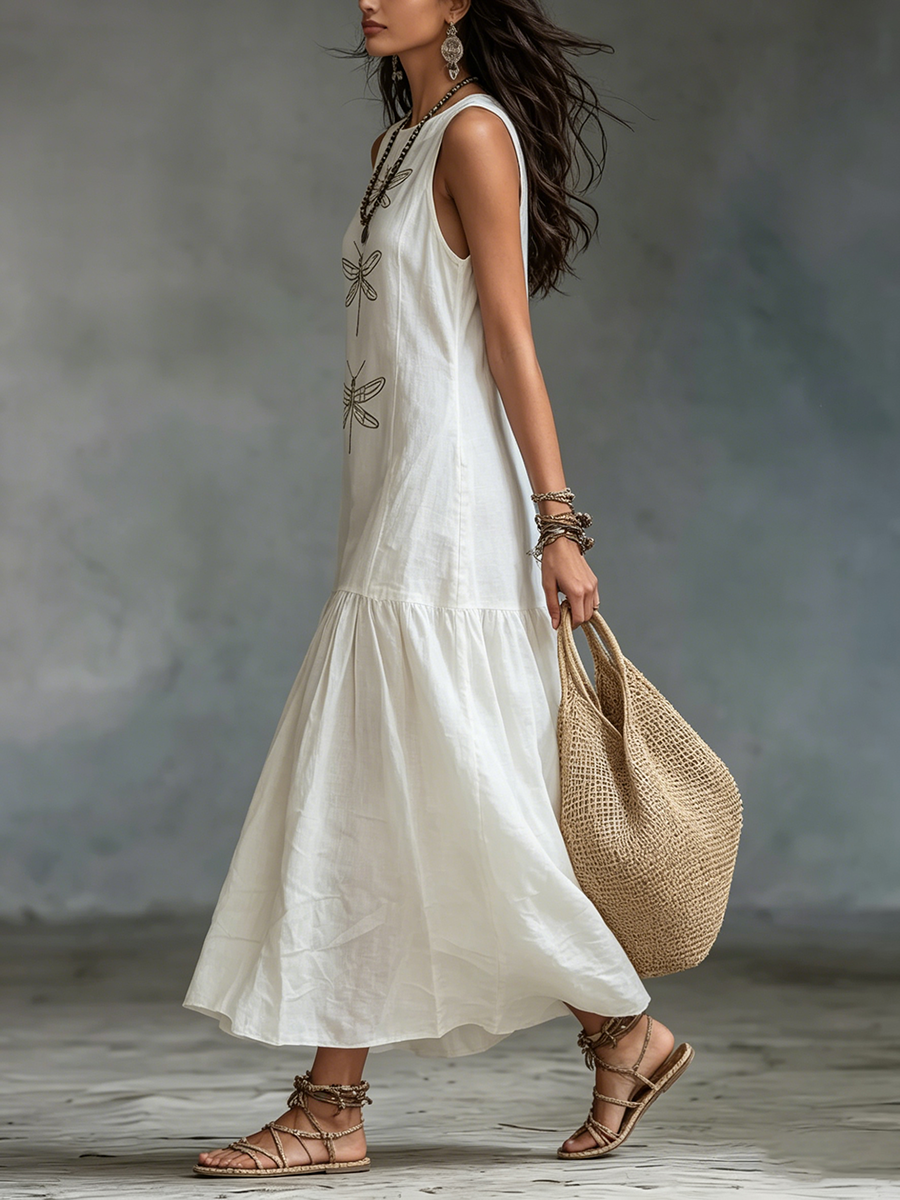 White sleeveless maxi dress with embroidered dragonfly motif and tiered hemline
