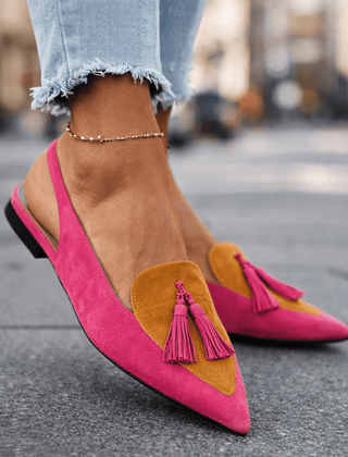 Pink suede tassel sandals with tan/mustard triangular accents and flat black sole