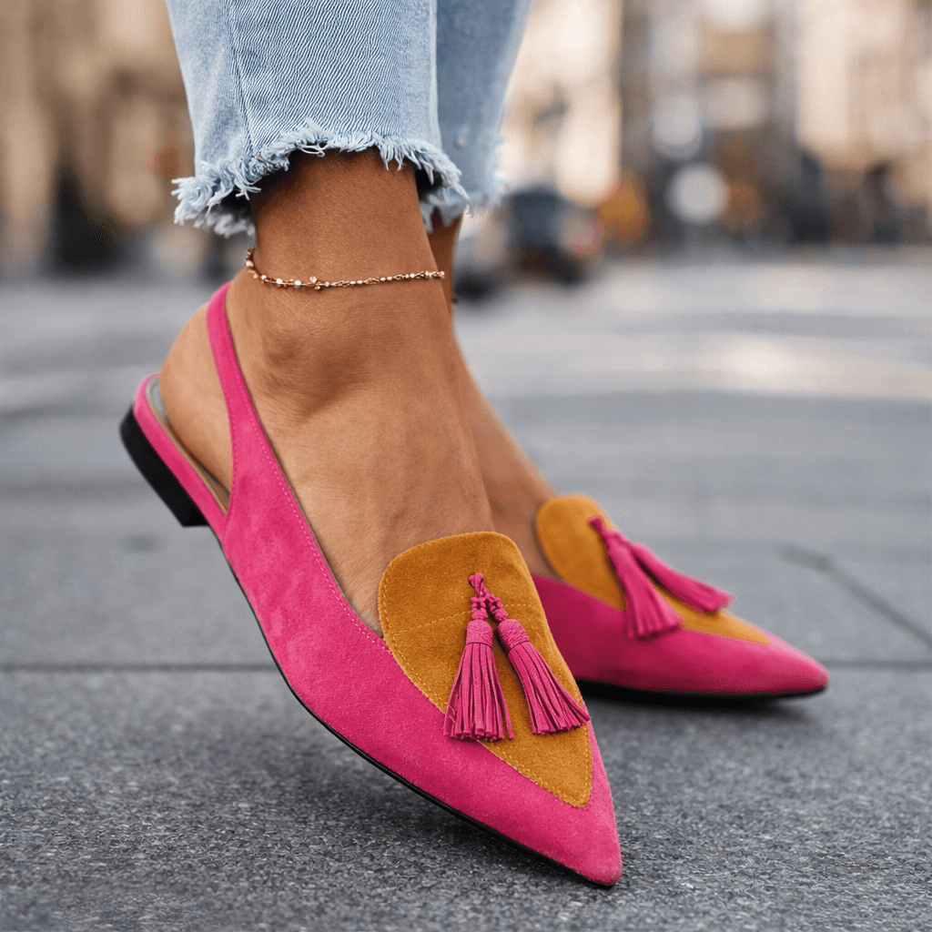 Pink suede tassel sandals with tan/mustard triangular accents and flat black sole