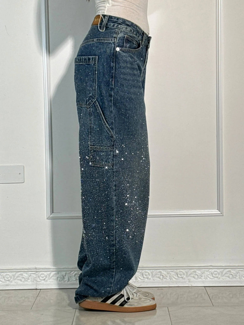 Dark indigo diamond trousers with white speckle wash, wide-leg denim with belt loops