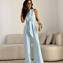 Sky blue sleeveless jumpsuit with wrap V-neck and tied waist, wide-leg