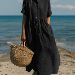 Black collared button dress with short sleeves and gathered waist