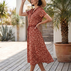 Red printed belted midi dress with short sleeves and button-front detail