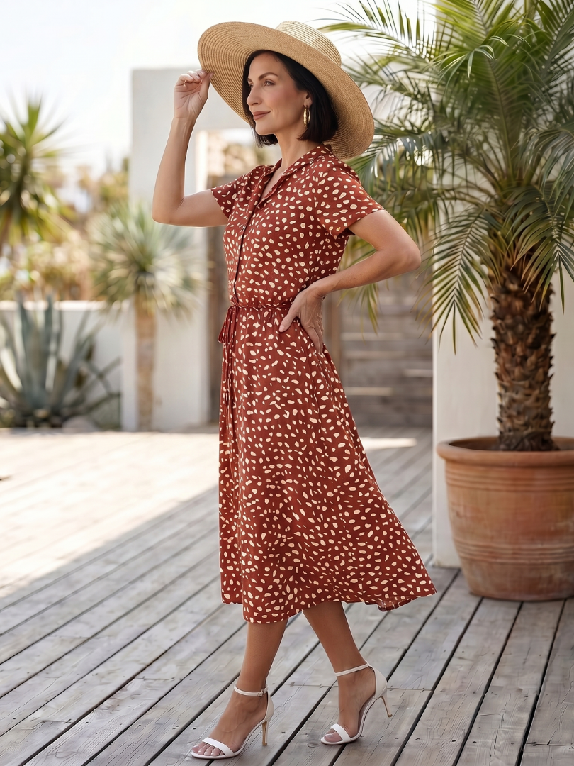 Red printed belted midi dress with short sleeves and button-front detail