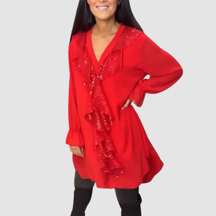 Red ruffled blouse with glitter sequin detail at neckline, long sleeves, tunic length