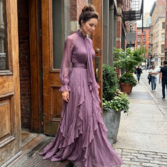 Purple tie-neck tiered maxi dress with cascading ruffle hem and sheer sleeve cuffs