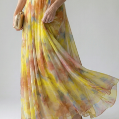 Soft wrap maxi dress with yellow, orange and blue watercolor print, flowing chiffon hem