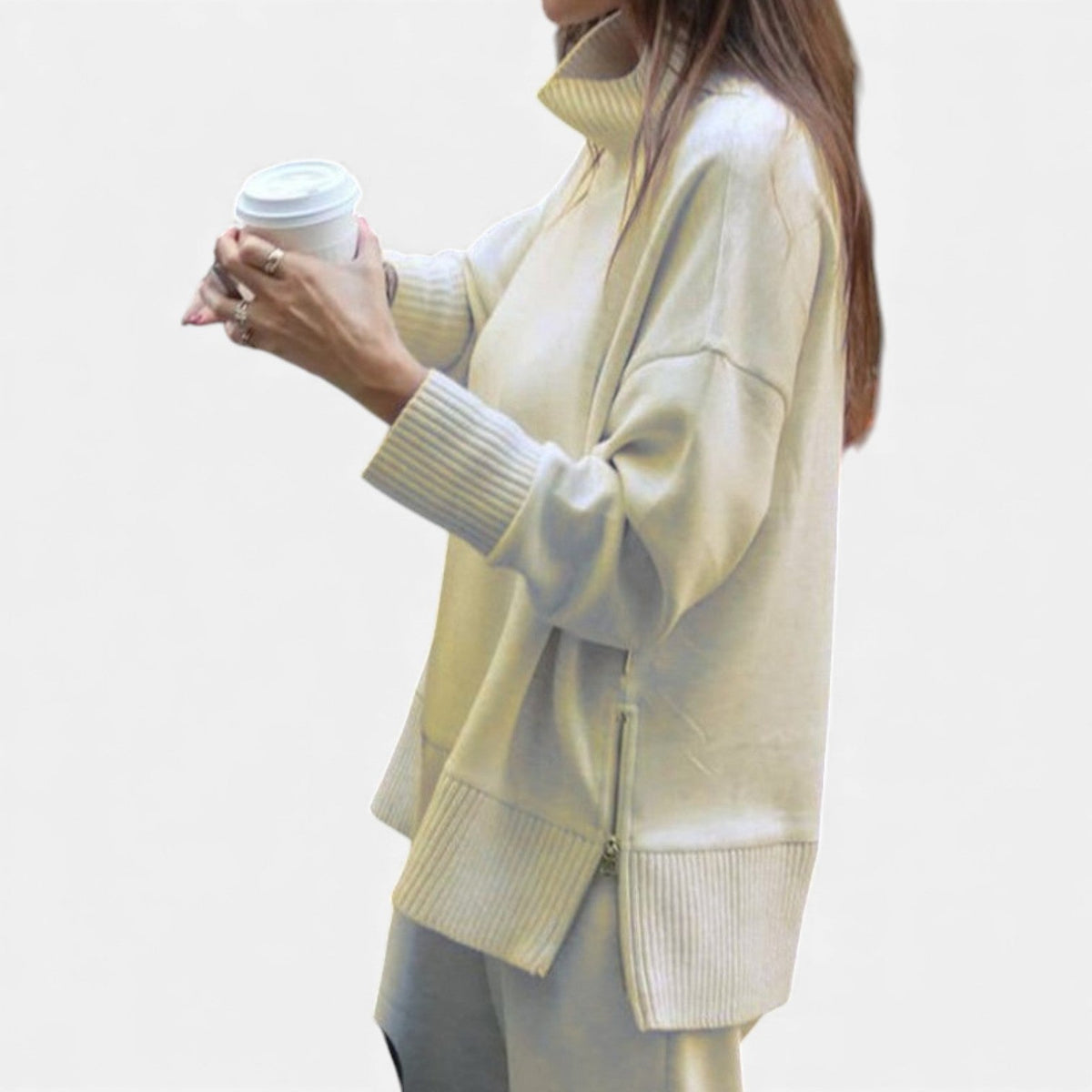 Women's off-white knit lounge set with crewneck sweater and ribbed hem pants