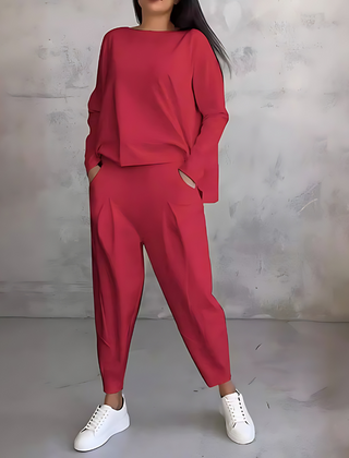 Red two-piece lounge set with long-sleeve sweatshirt and tapered ankle jogger pants