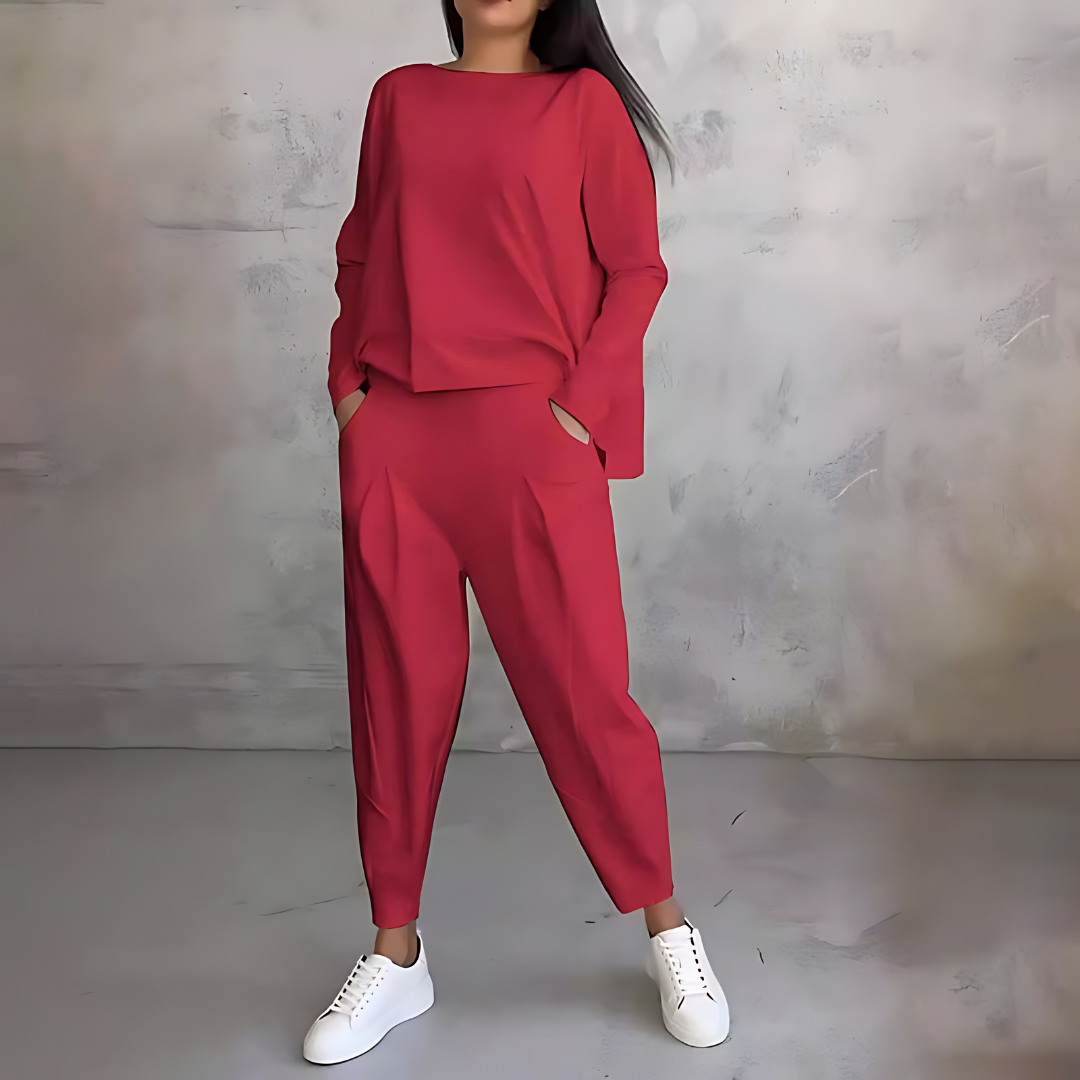 Red two-piece lounge set with long-sleeve sweatshirt and tapered ankle jogger pants