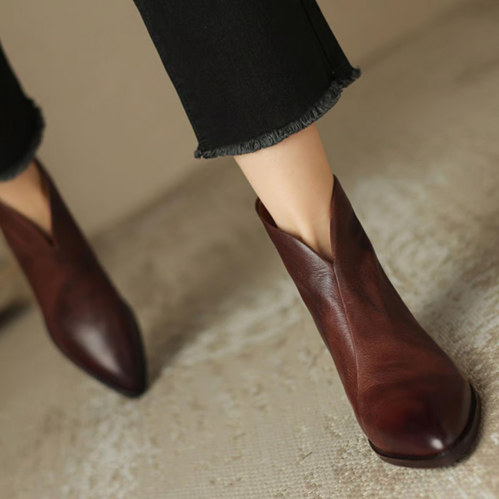 Brown leather ankle boots, angled view with pointed toe and low block heel
