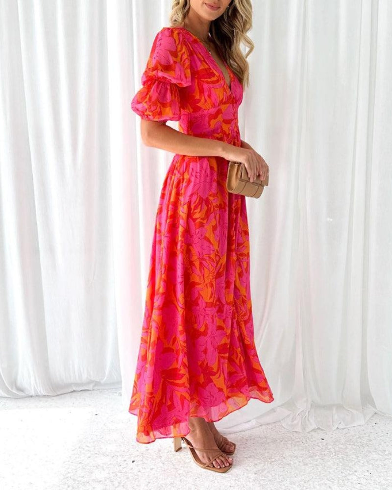 Long ruffled-sleeve maxi dress, pink and magenta floral pattern, V-neck front