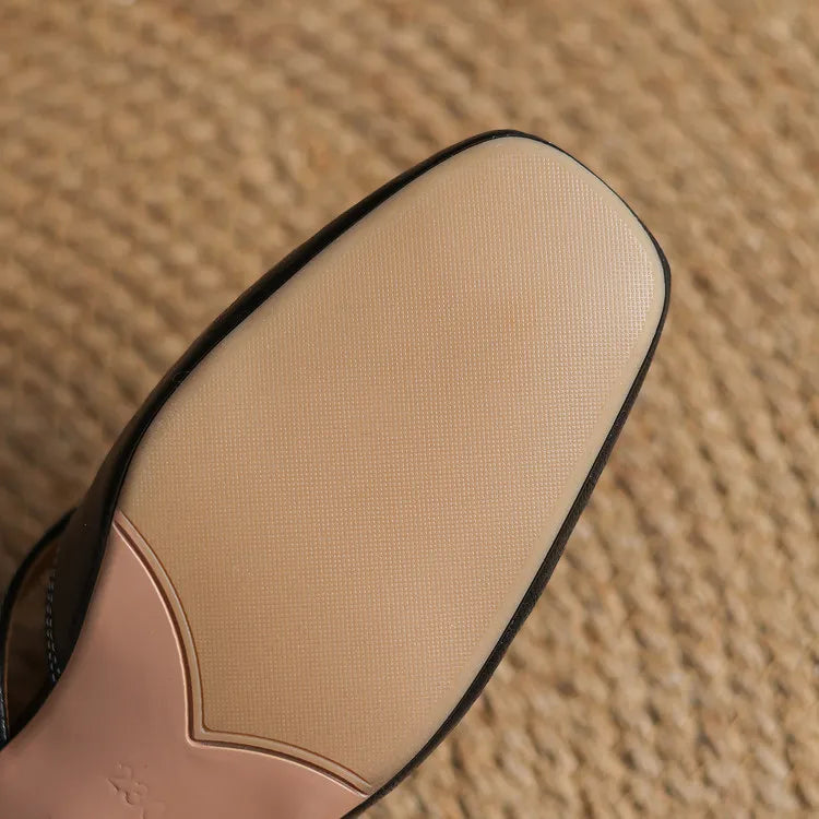 Apricot leather mule outsole view with black-edged sole panel