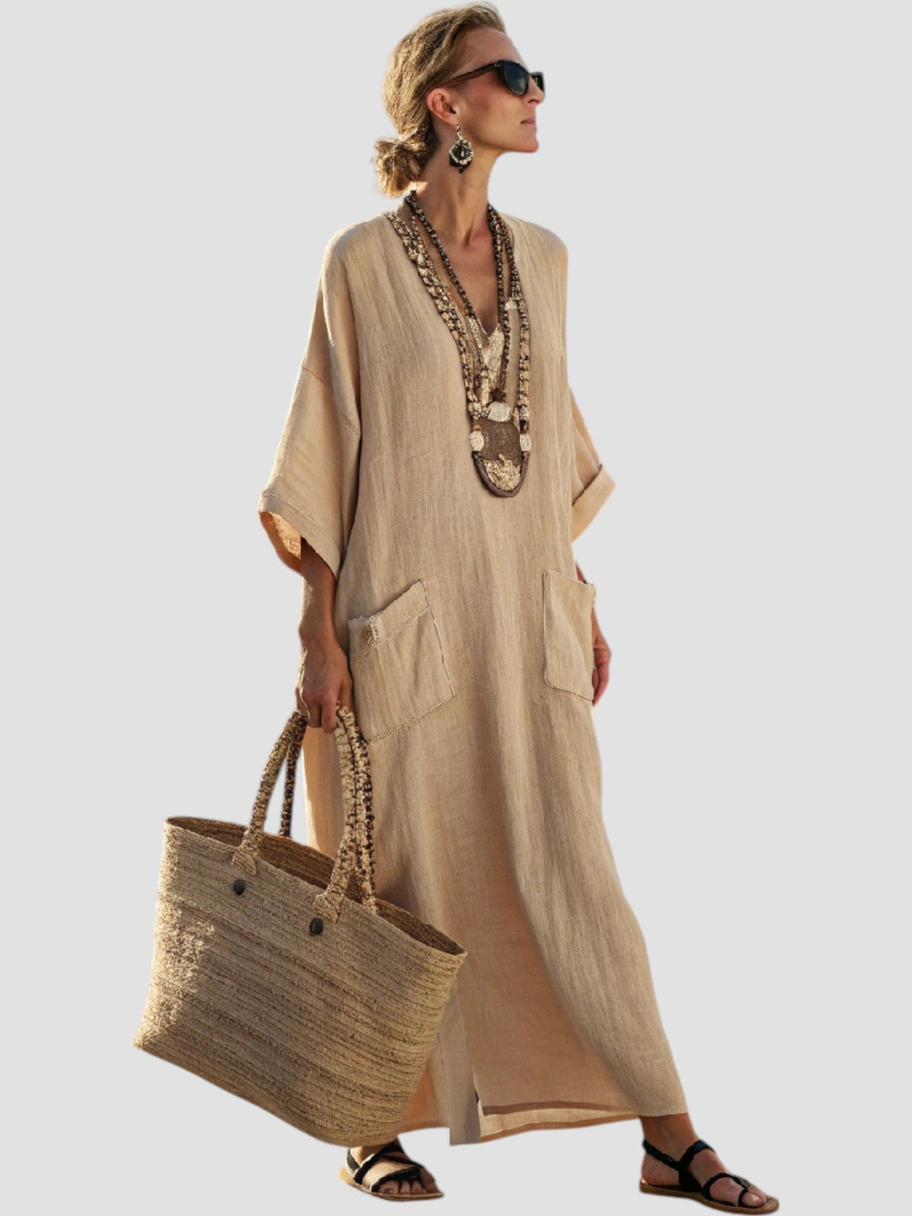 Beige V-neck midi dress with layered pockets and short dolman sleeves