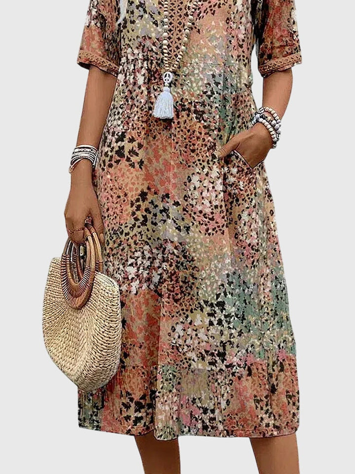 Floral midi dress with V-neck button front and white tassel, relaxed A-line fit