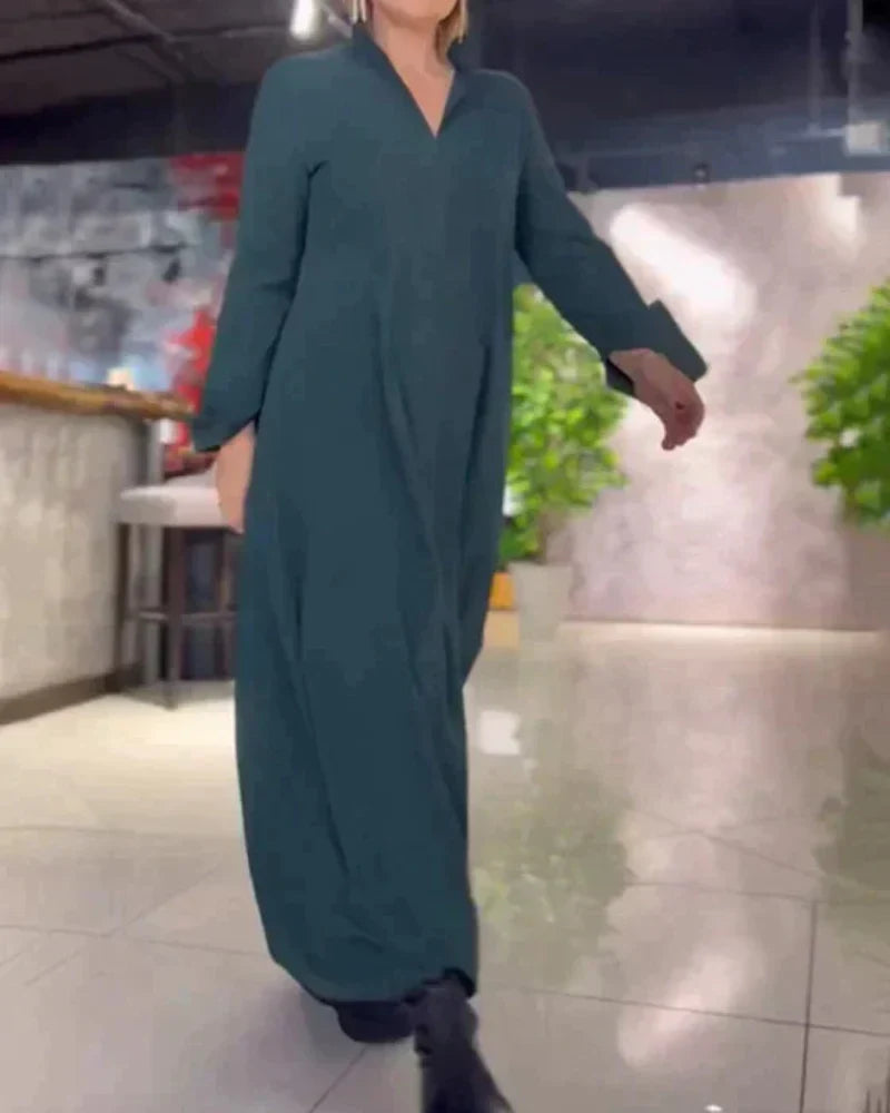 Dark green long dress with V-neck, loose fit, and long sleeves