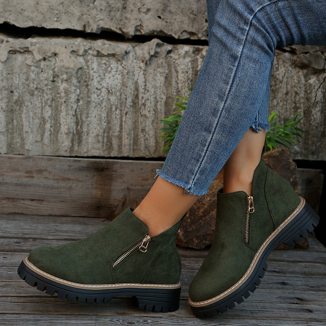 Suede ankle boots with side zip and chunky sole, dark green with tan trim