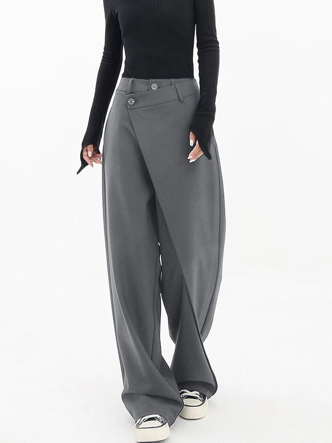 Grey baggy trousers with high waist, button front, and wide draped legs