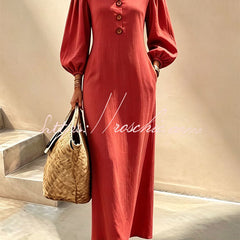 Red v-neck maxi dress with button front and lantern sleeves