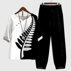 Two-piece set: black and white short-sleeve top and matching pants, fern leaf graphic