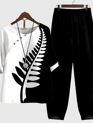 Two-piece set: black and white short-sleeve top and matching pants, fern leaf graphic