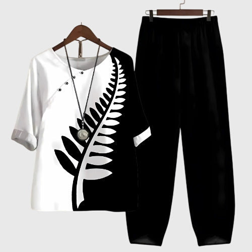 Two-piece set: black and white short-sleeve top and matching pants, fern leaf graphic