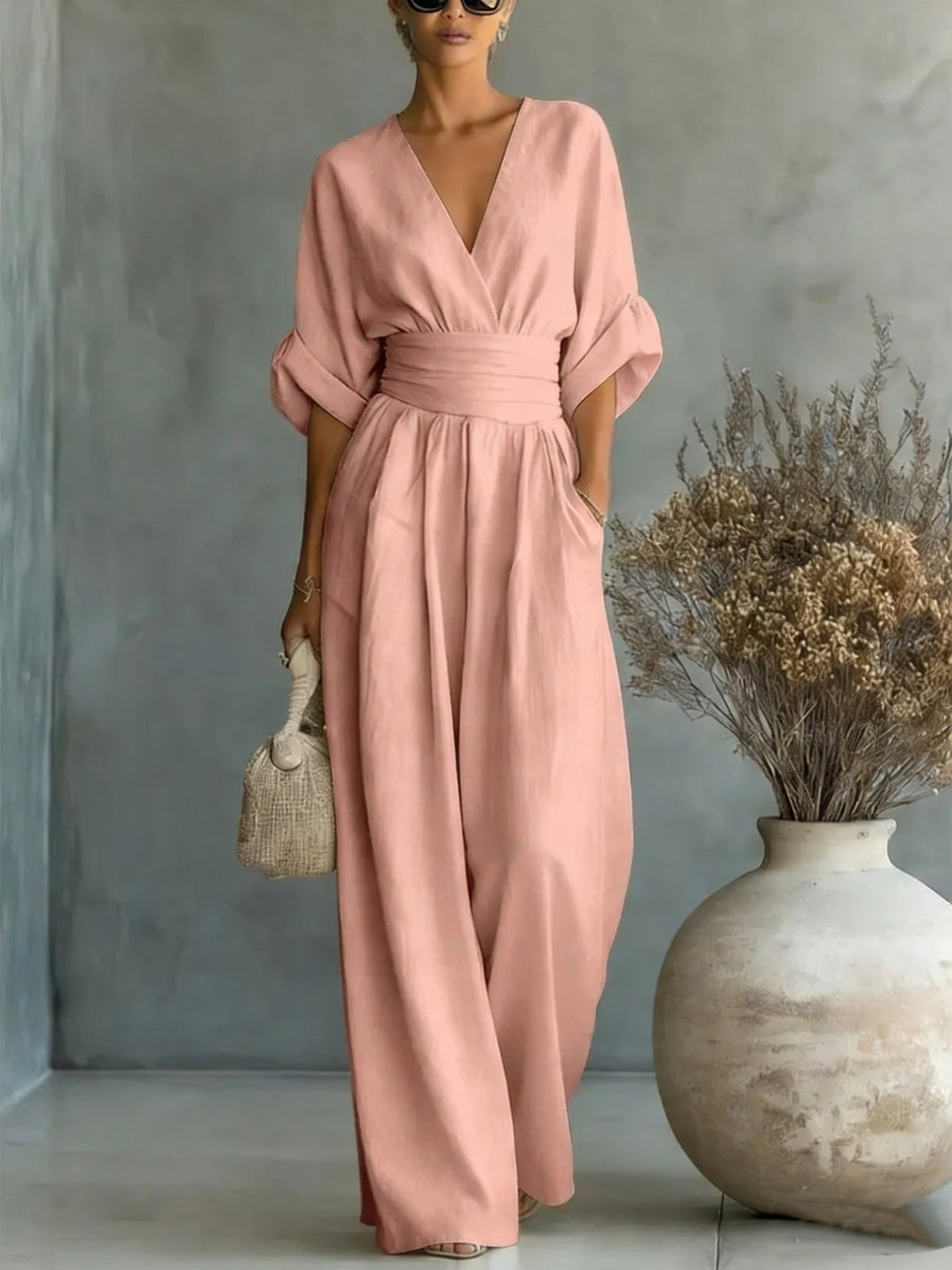 Women’s wide-leg jumpsuit in blush pink with V-neck and gathered waist