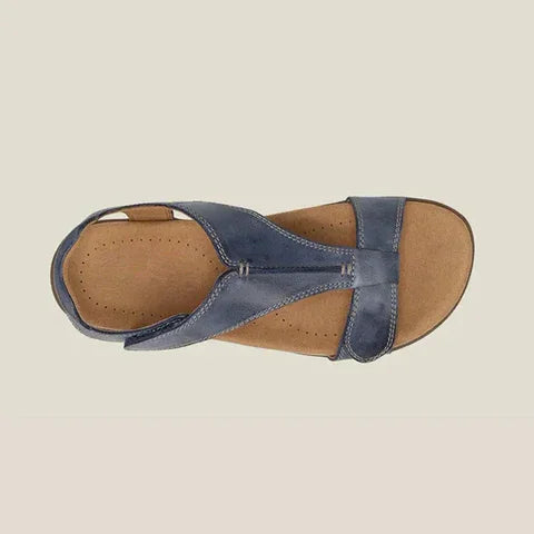 Blue orthopedic vegan leather sandal, side view with open toe and wide strap.