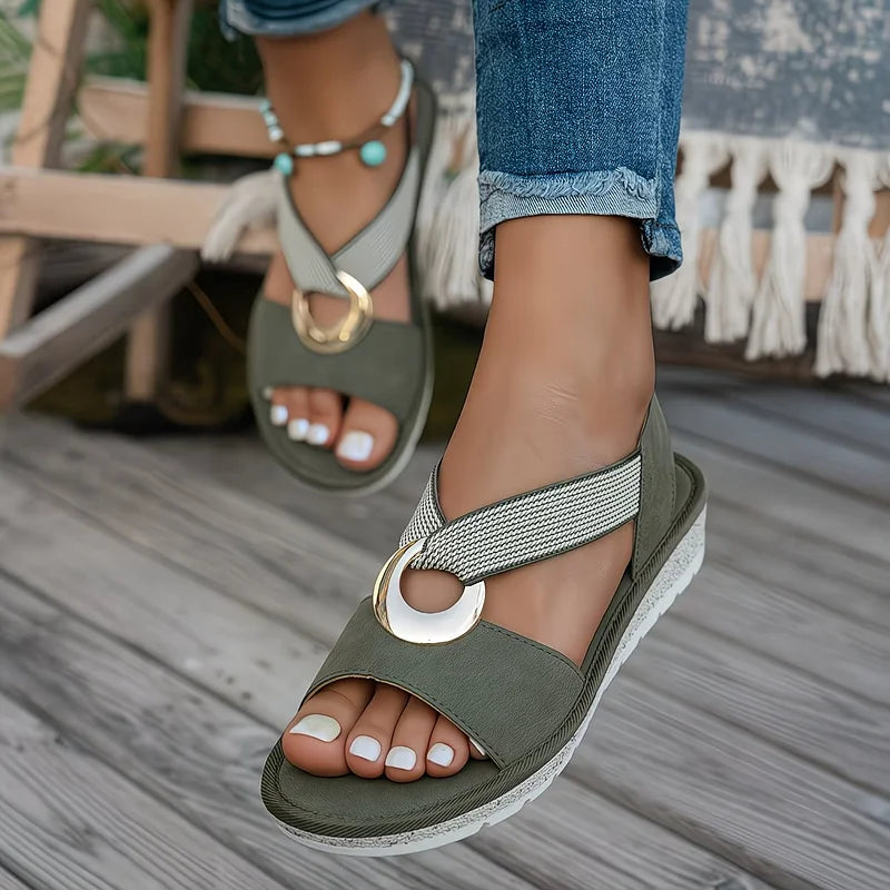 Olive flat sandals with oval metal buckle, textured strap and beaded trim